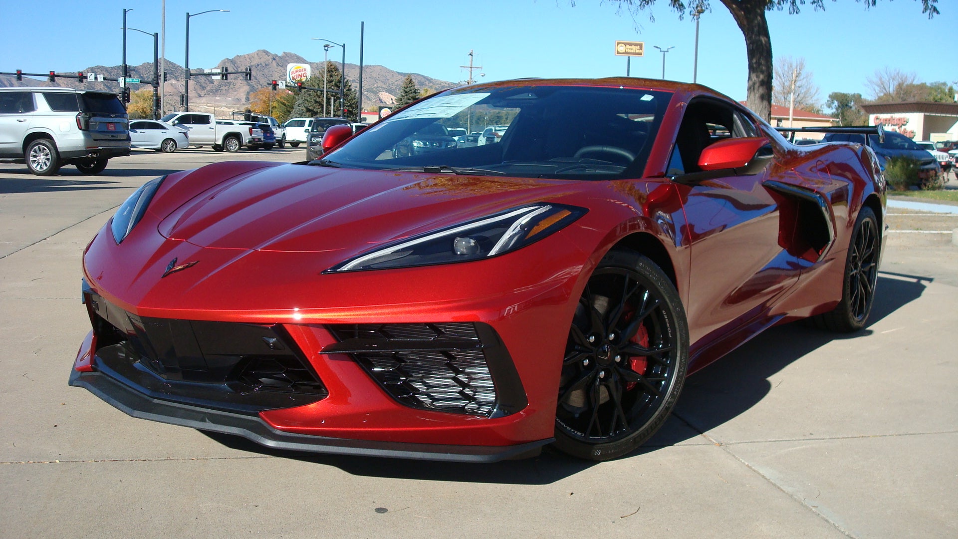 2026 Chevrolet Corvette Stingray 2LT in Red Mist Metallic Tintcoat — front three-quarter view