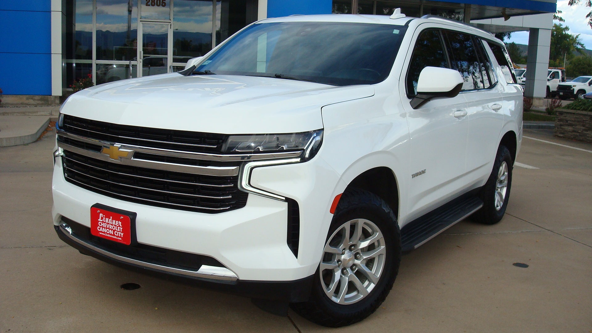 2021 Chevrolet Tahoe LT in Summit White — front three-quarter view