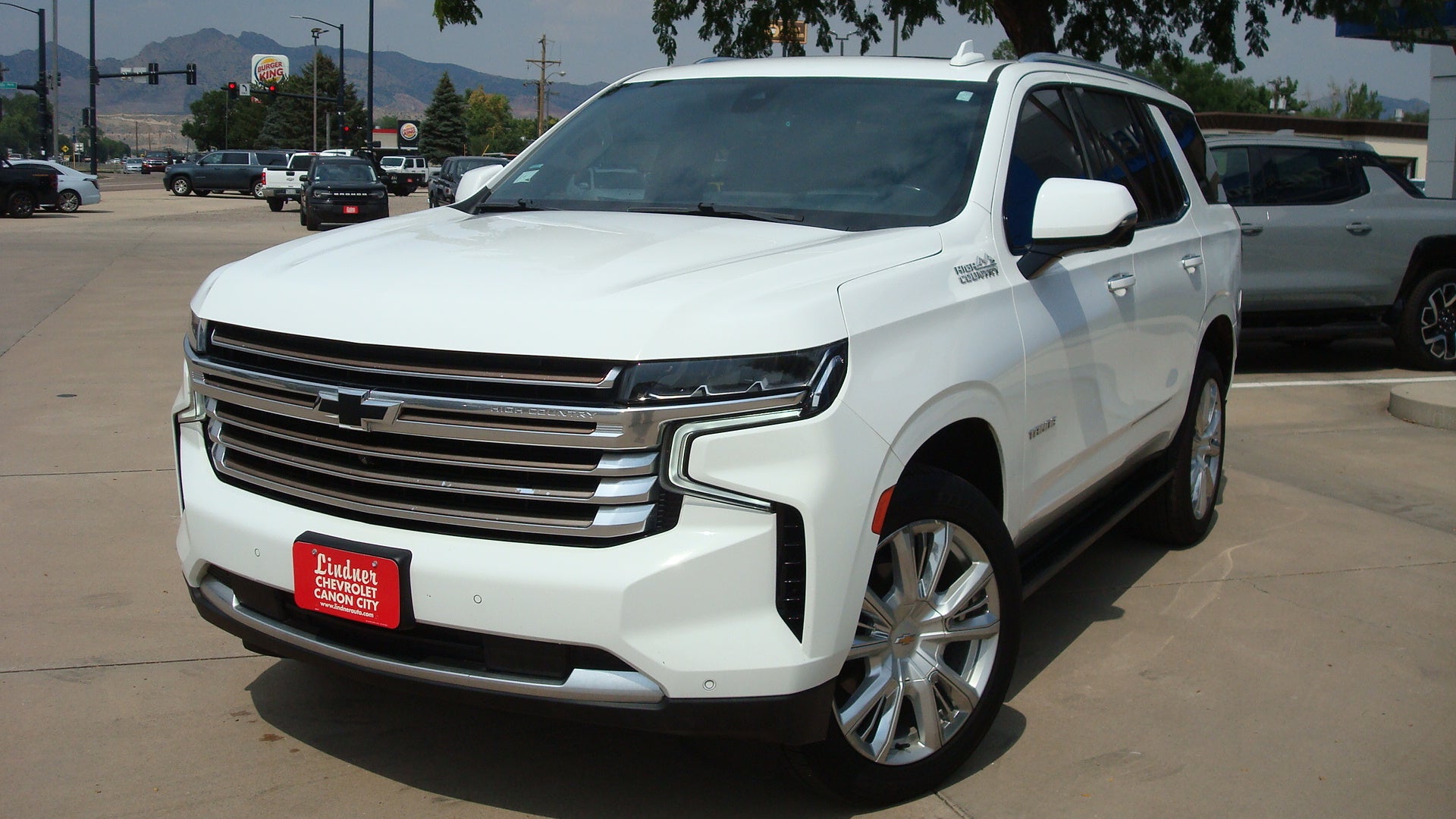 2021 Chevrolet Tahoe High Country in Summit White — front three-quarter view