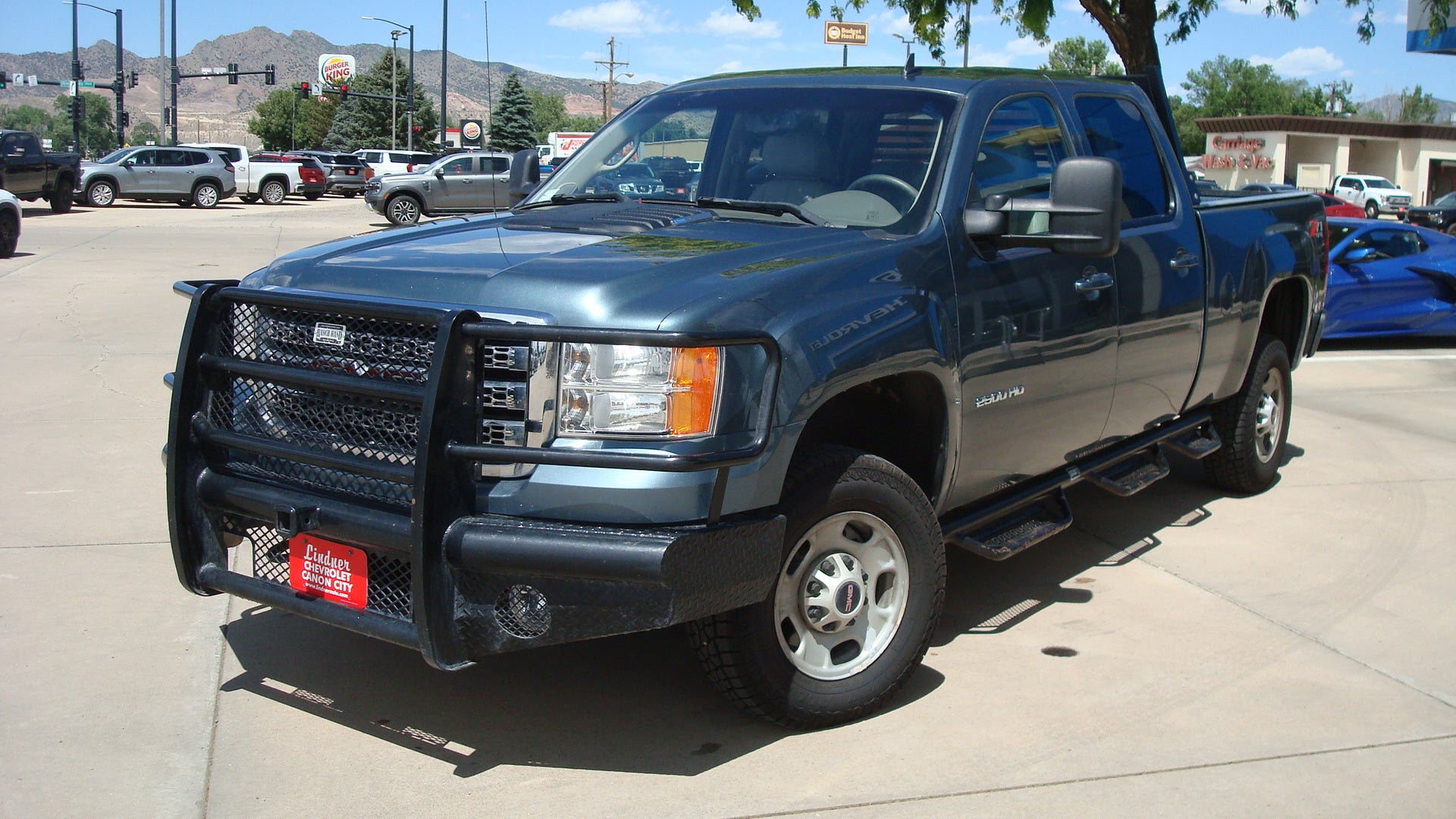 2014 GMC Sierra 2500 HD SLT in Stealth Gray Metallic — front three-quarter view