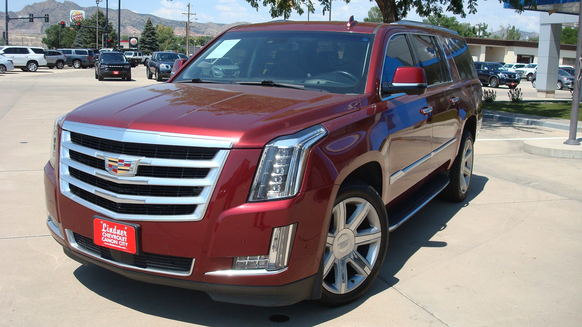 2020 Cadillac Escalade ESV Premium Luxury in Red Passion Tintcoat — front three-quarter view