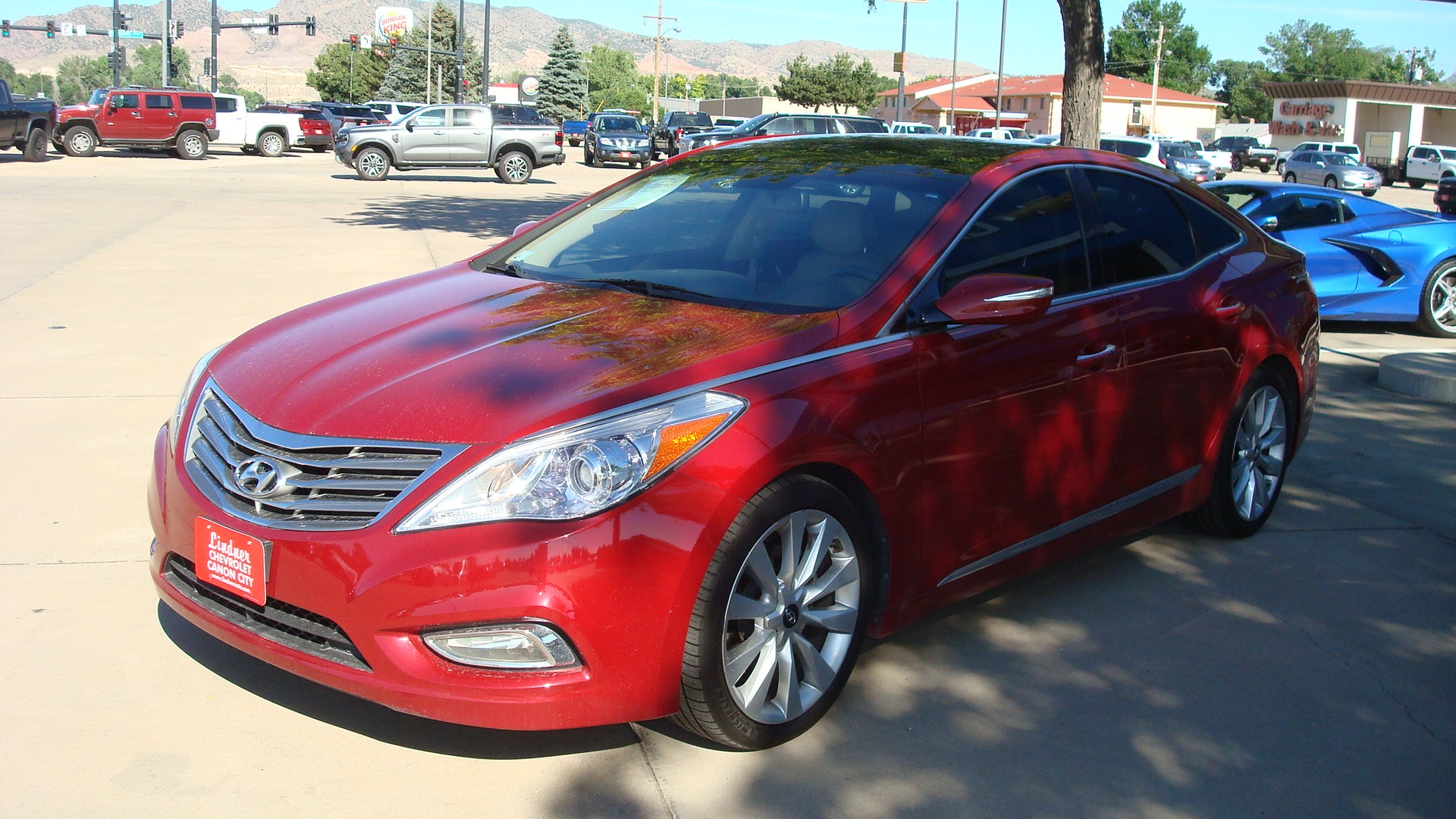 2014 Hyundai Azera Limited in Red — front three-quarter view